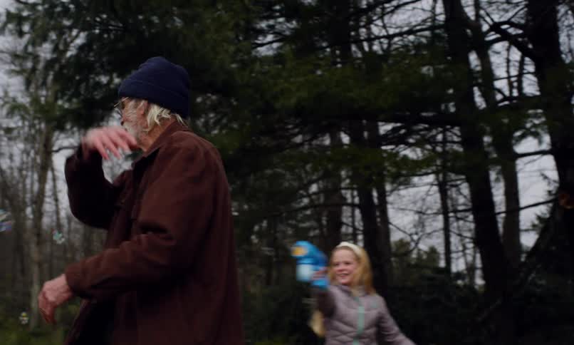 A clip of kids playing with an elderly man