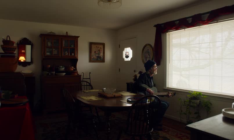 A clip of a person playing a guitar