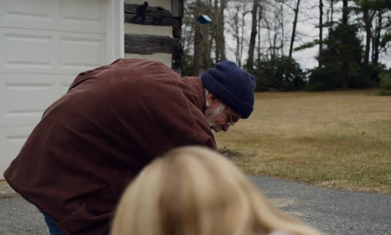 Grandfather with his two grandchildren and playing hopscotch in the backyard