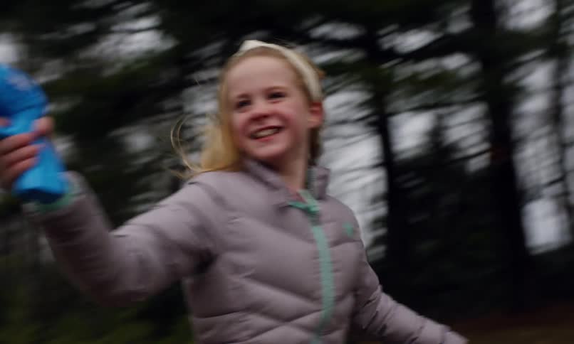 A footage of a girl running while having fun