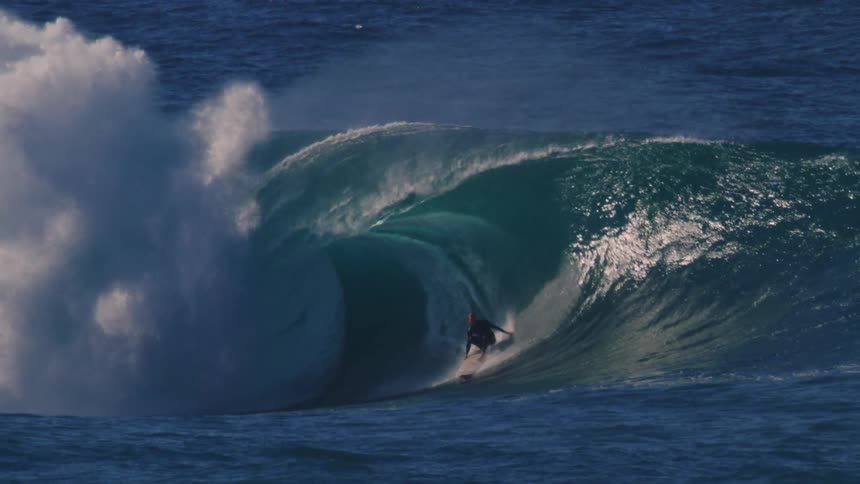 Person tubing a tubular wave