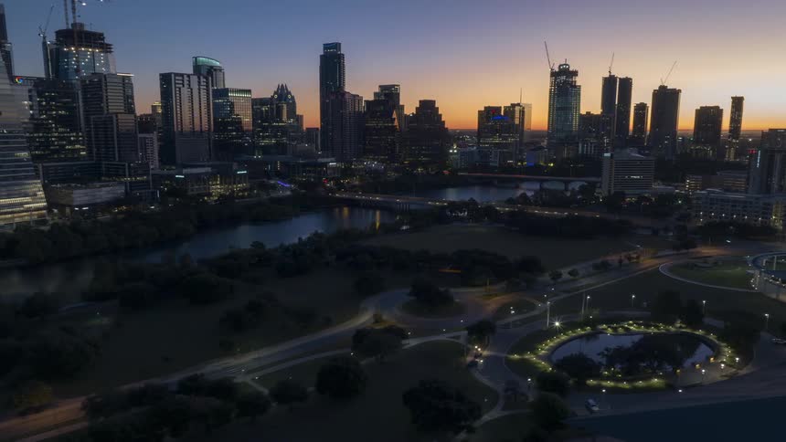 Traffic flows on the roads of a city as the sun rises