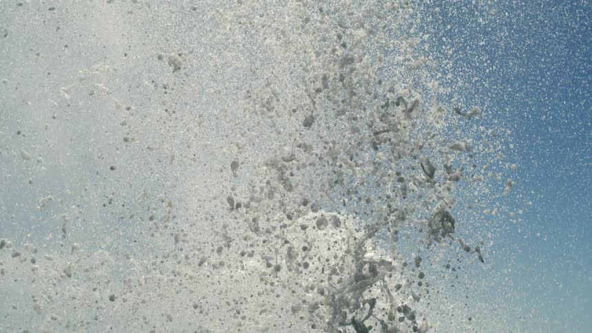 Landscape of a blue sky with jets of water rising