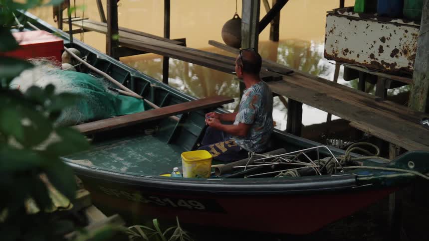 Man sitting in a fishing boat