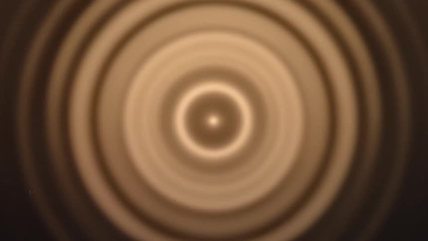A series of concentric circular interference patterns likely resulting from a wave of light or sound