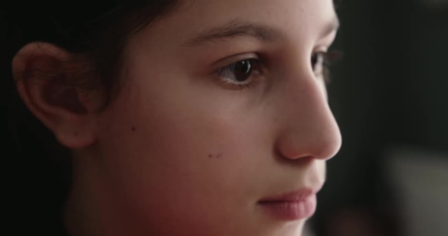 Side portrait of a black haired girl