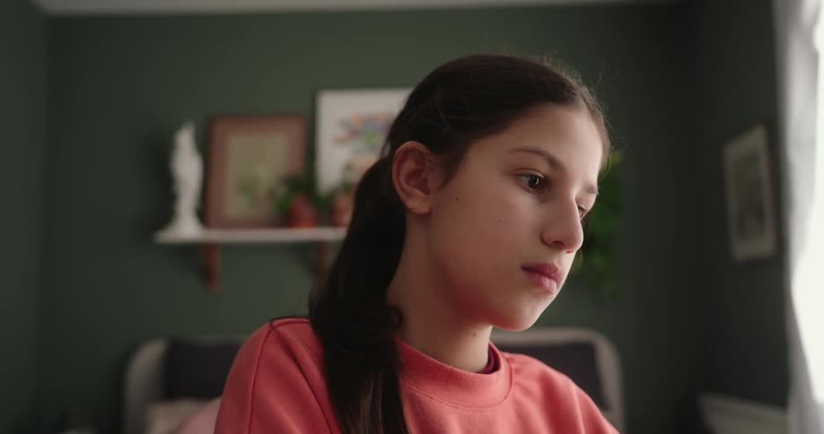 Girl sitting typing on a laptop