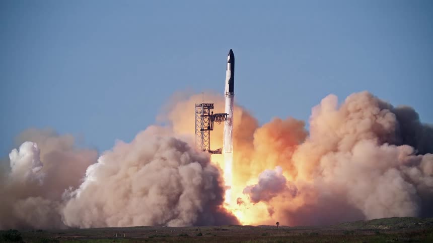 Engines flare and produce smoke as a SpaceX Starship rocket launches