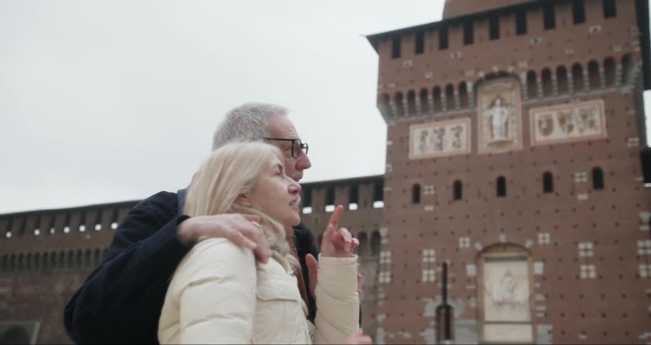Elderly couple together traveling and enjoying classical structures