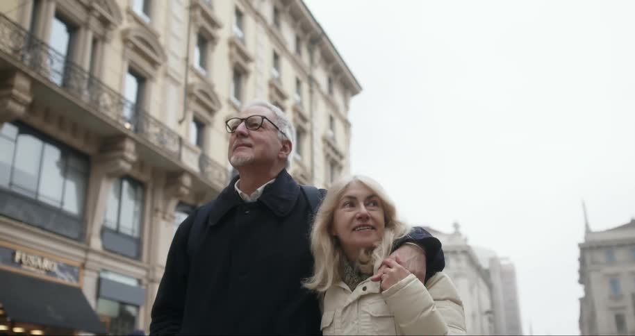 A footage of elderly couples walking the street