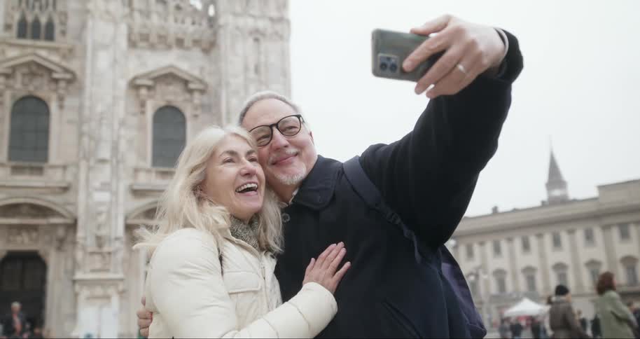 Tourists take a selfie in front of the cathedral