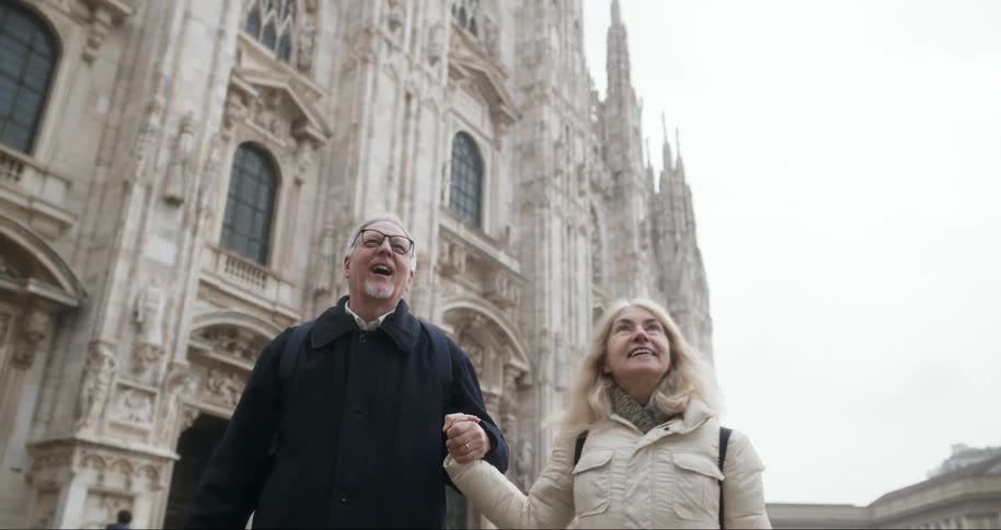 A footage of a man and a woman holding hands