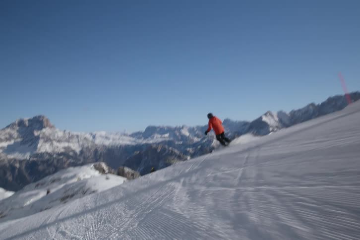 A man is skiing on a snow covered mountain