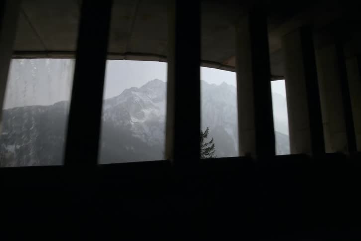 Interior view of snowy mountains and conifers