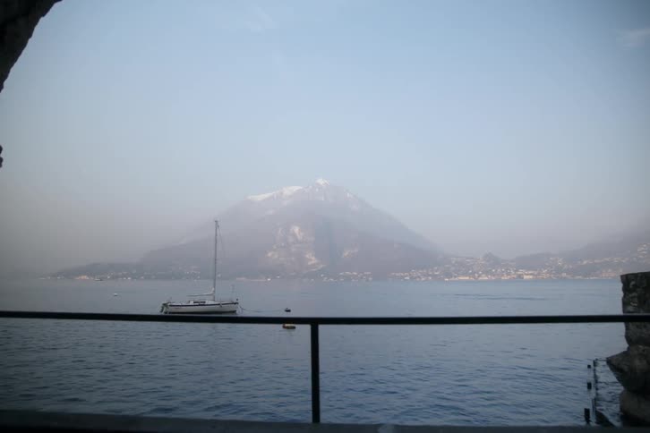 Across the water is a fog covered mountain