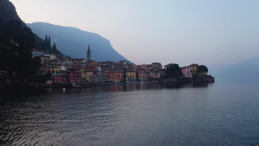 Picturesque village of classic colorful houses at the foot of a mountain by the sea