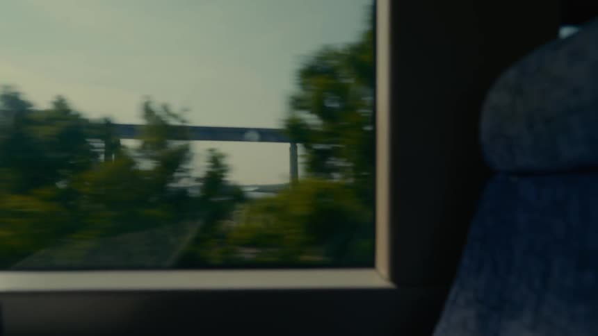 A train is traveling past a bridge