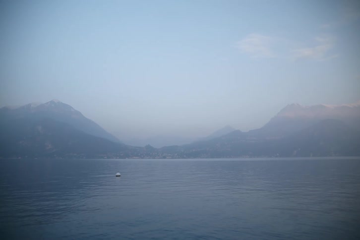 Heavy fog hangs on the lake