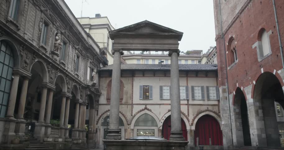 Classical arch in the center of a city with old buildings