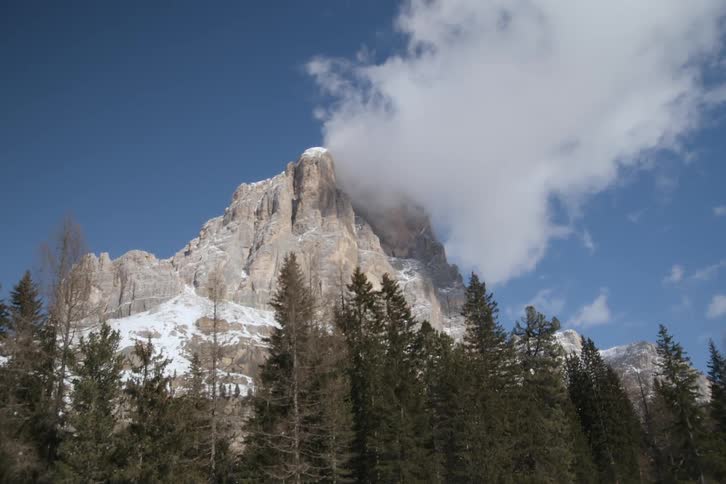 The cloud sits on the mountain peak