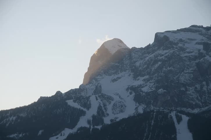 A mountain peak is covered in snow and ice
