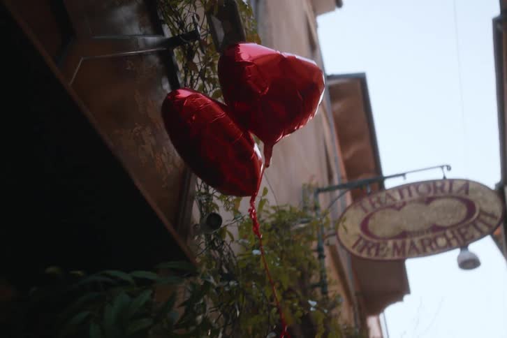 Two gas heart balloons floating