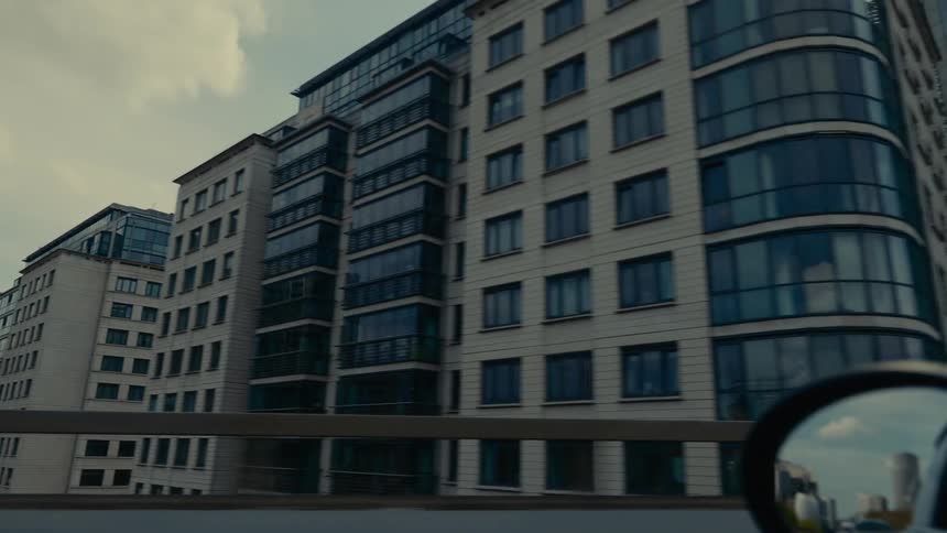 View of buildings through the window of a moving vehicle