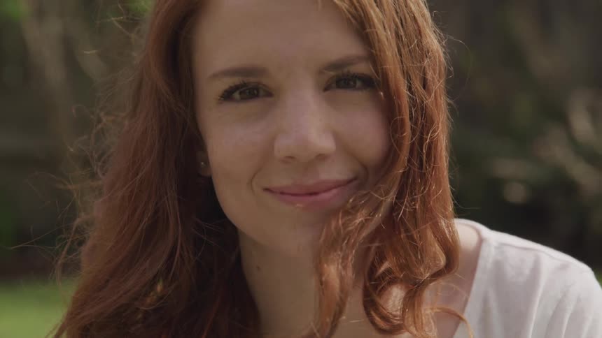 Portrait of a smiling redheaded woman