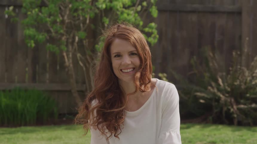 A footage of a lady smiling outdoor