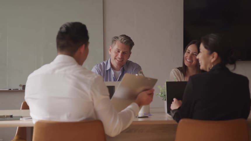 A footage of people in an office having a meeting