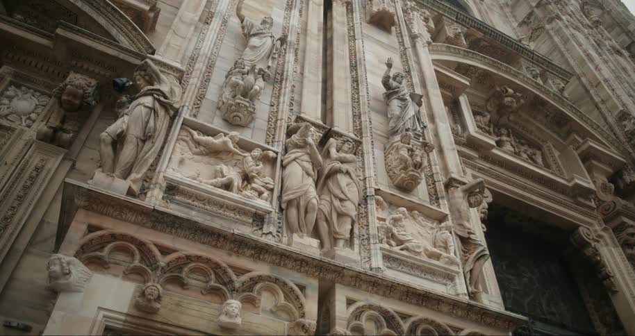 The wall of the building is full of statues