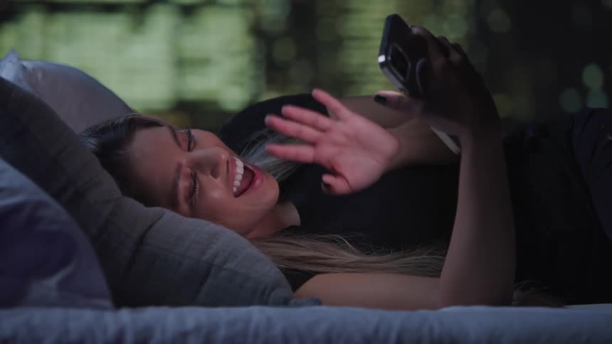 A footage of a lady having a conversation on a smartphone