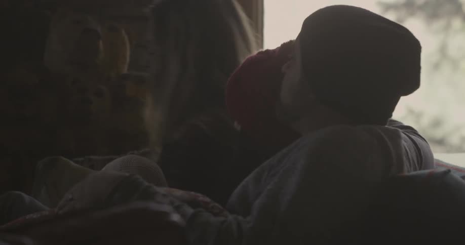 Several adults enjoying each other's company on a sofa