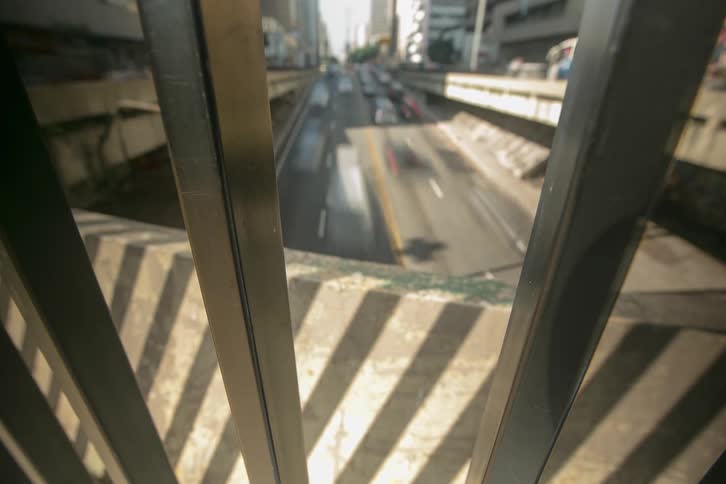 Heavy traffic moves along roads passing through downtown on a sunny day