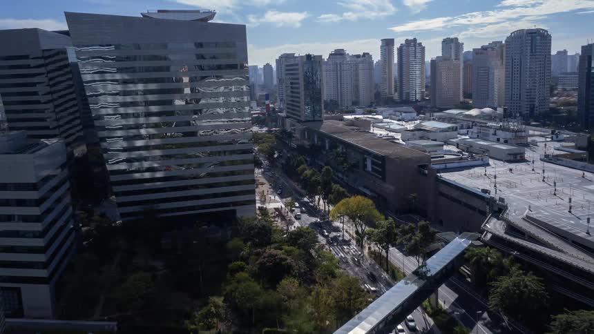 Traffic runs through the city on a sunny day