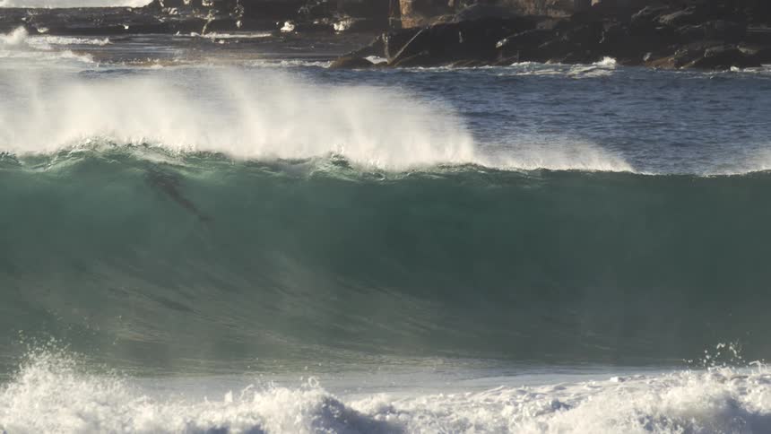 Large waves are crashing on the shore