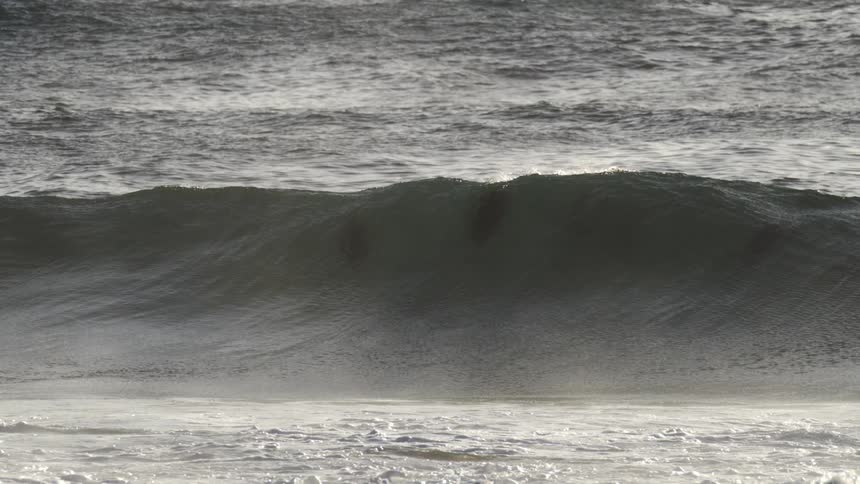 Large wave forming in middle of ocean in slow motion