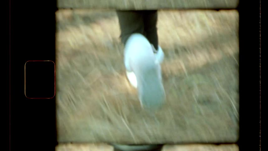 Child runs through an area with snow and trees