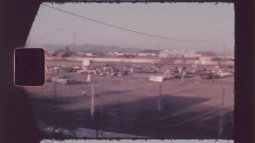 Public watching passing racing cars at the racetrack