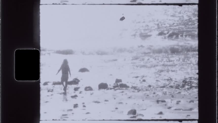 A footage of a girl walking by the seashore