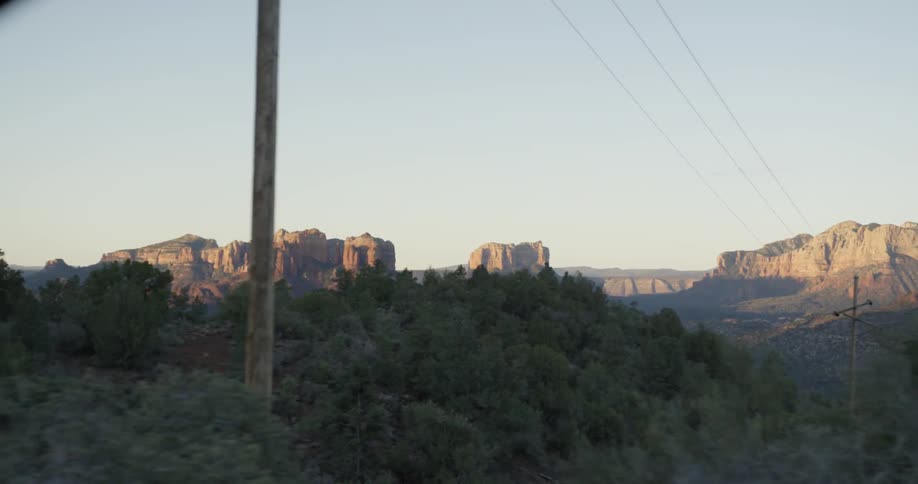A power line stretches over trees in the wilderness