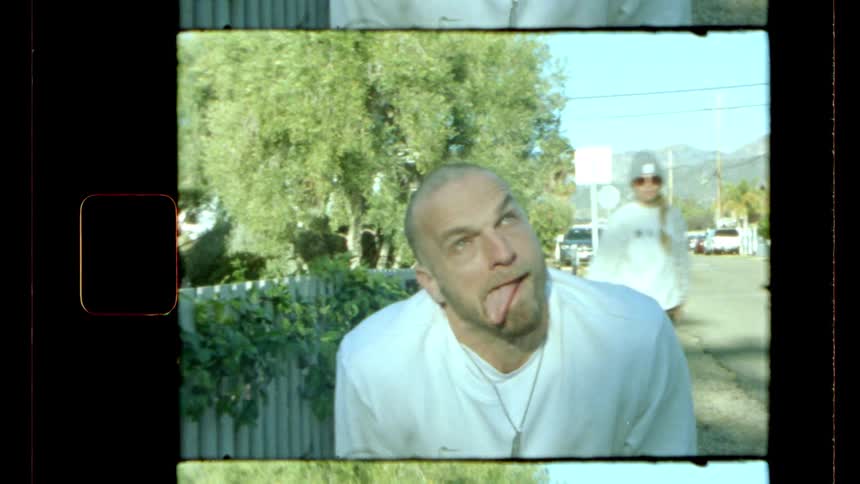A man smiles and sticks his tongue out