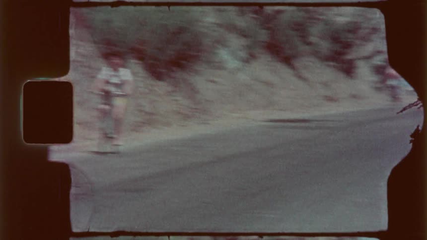 People riding bicycles on a seaside highway