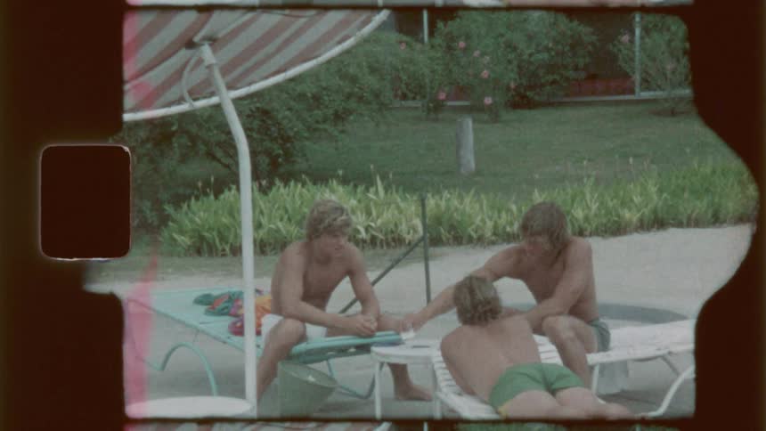 Friends are playing cards in the yard