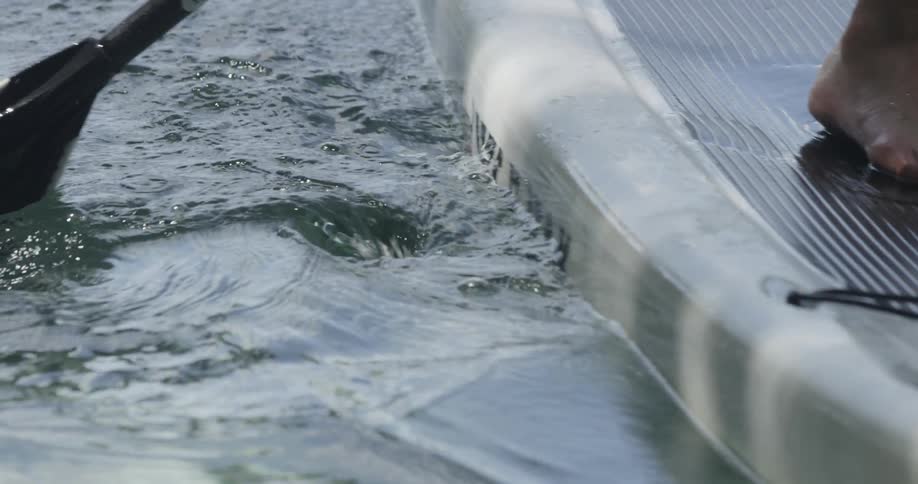 A paddle pushing through water
