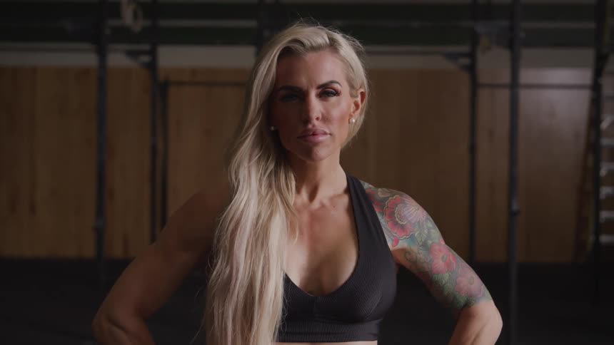 A woman has a large tattoo on her shoulder
