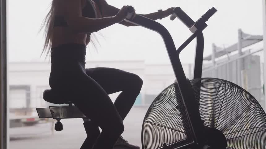 Woman pedaling on an exercise bike