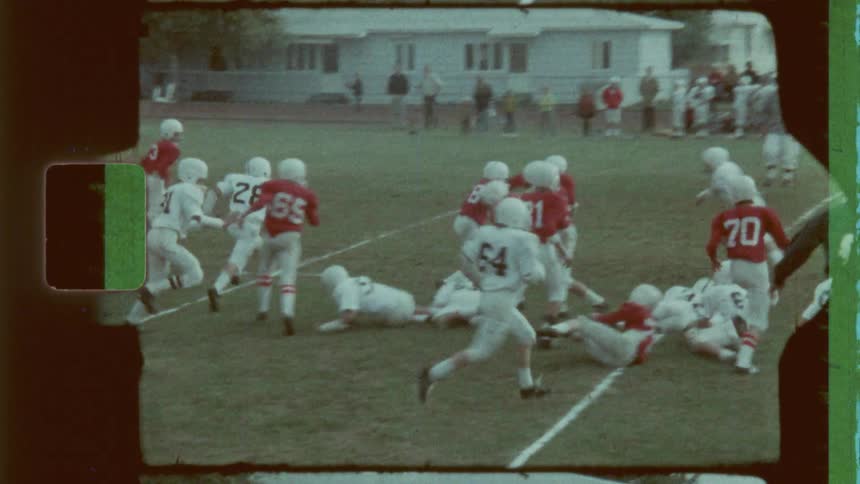 Team of teenagers playing american football