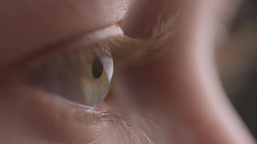 A person slowly blinks their eye