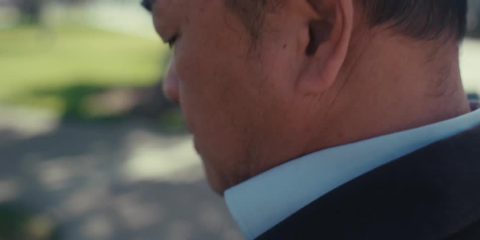 A man is writing on his tablet with a stylus